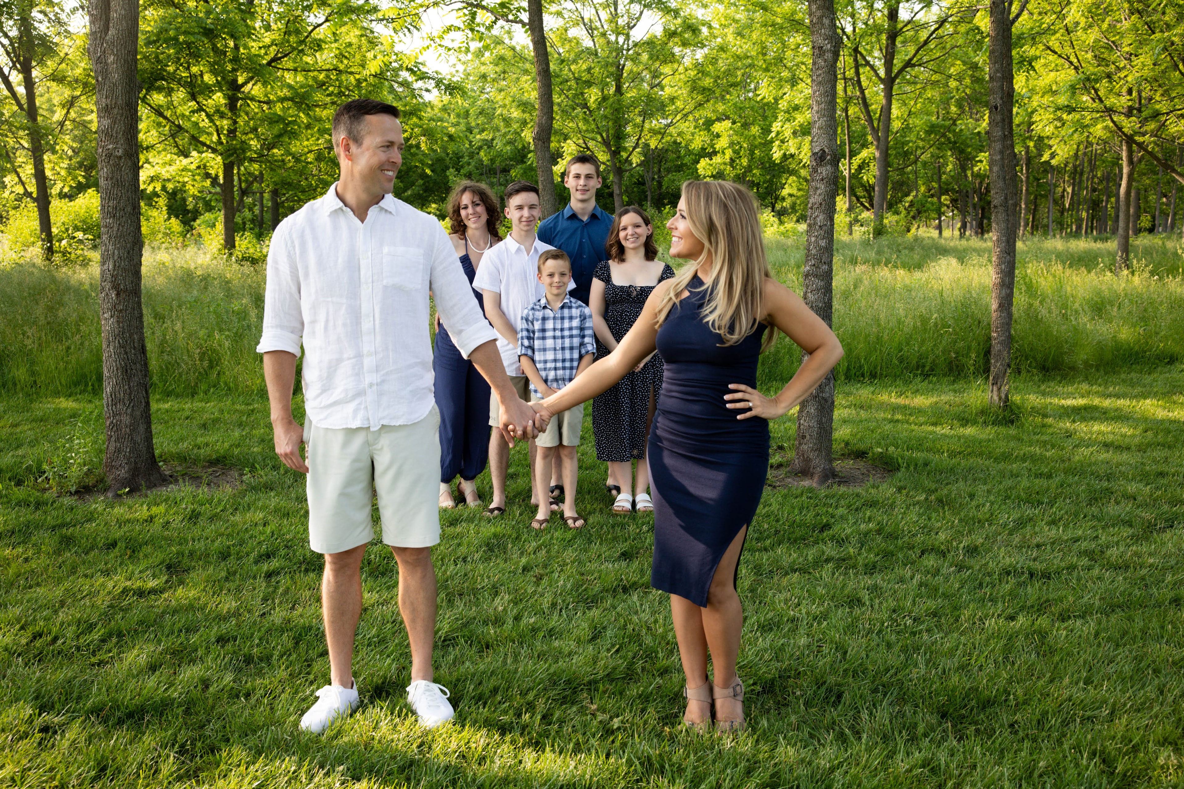 Ashley and her husband laughing together outdoors